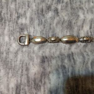 Vintage  Silver Tone  (with designs) link bracelet with magnetic closure.